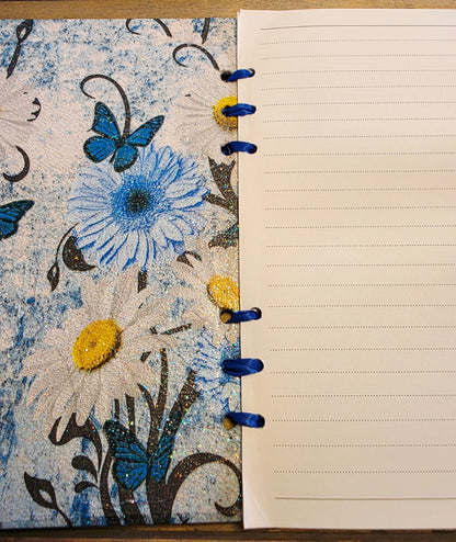 Notebook with floral design on cover and lined pages