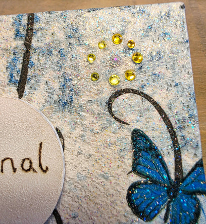 yellow gemstones on a blue floral background