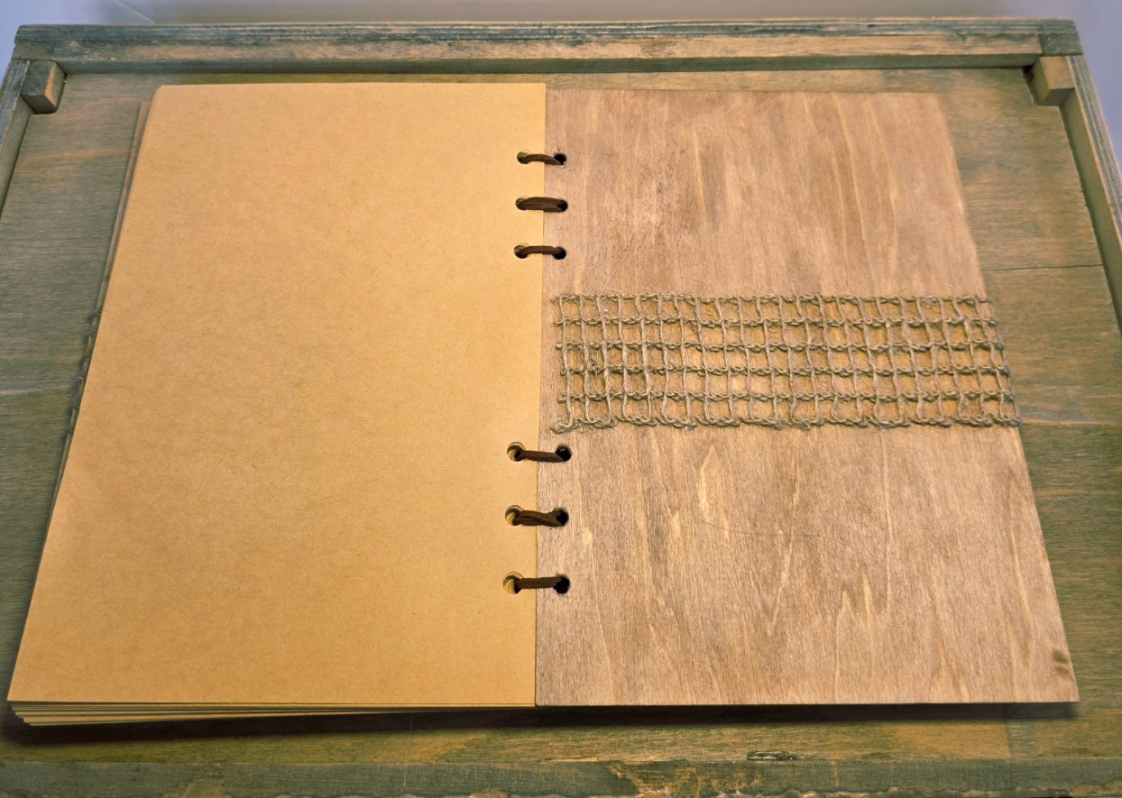 wooden journal. Burlap mesh across the middle of the inside back cover. uede leather bound with beige plain pages
