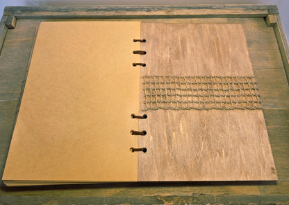 wooden journal. Burlap mesh across the middle of the inside back cover. uede leather bound with beige plain pages