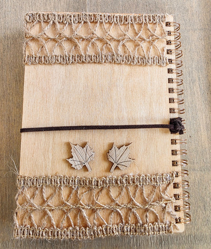 wooden Notebook with burlap detail top and bottom. and leaf decorations. Dark brown suede tie